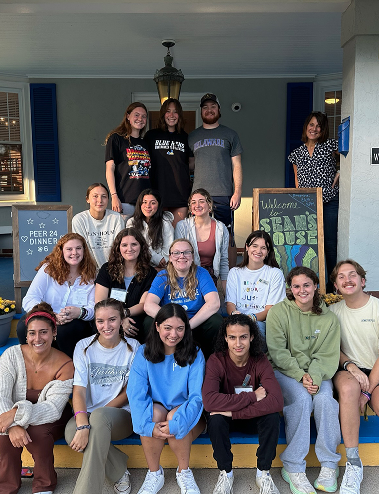 Some of our Peer24 Leads sitting on the stoop at 136.